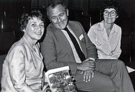 Photograph of Tom Norton Sitting in the Middle of Two Unknown Women