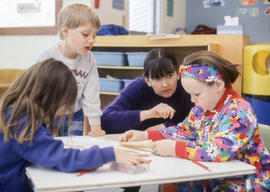 Photograph of an Early Childhood Education student working with students