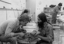 Photograph of Students Working with a Pottery Wheel in a Fine Arts Class