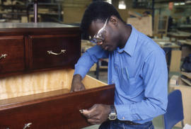 Photograph of a Student In The Cabinet Making Lab