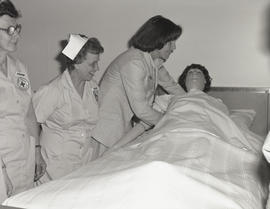 Photograph of nurses performing their duties