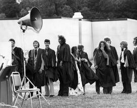 Photograph of Graduates Lining Up to Recieve Their Diplomas at Convocation