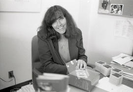Photograph of Heather Howe in an office at the creative writing workshop