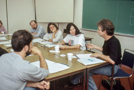 Photograph of author Peter Carey and attendees at workshop
