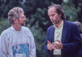 Photograph of Jim McMahon and Richard Ford conversing with each other