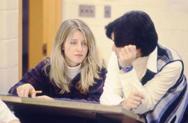Photograph of two students in an Interior Design drafting lab