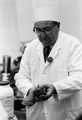 Photograph of Igor Sukor Working in the Kitchen