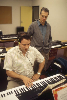 Photograph of a Music Student Practicing on an Electronic Keyboard