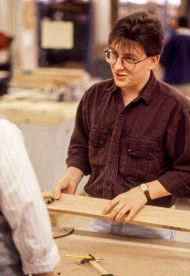 Photograph of a student in the Cabinet Making/Woodworking lab