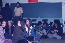 Students sitting on the floor : [photograph]