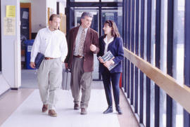 A photograph of students walking down a corridor