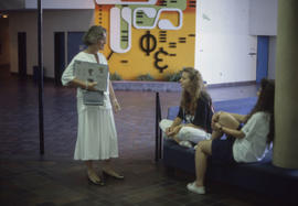 Photograph of Grace Allen Talking to Students in the E Concourse