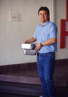 Photograph of Jose Vega delivering food on campus