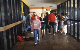 Photograph of students walking the hallway in the H building