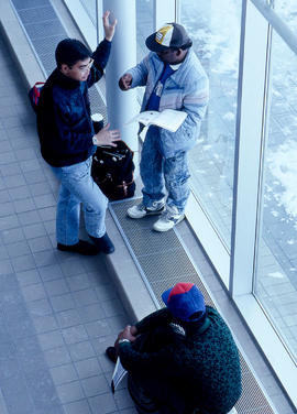 Photograph of students standing in a hallway