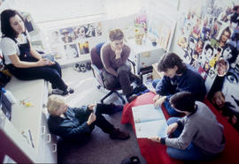 Photograph of students seated in a residence dorm