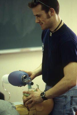 Photograph of student learning to administer CPR