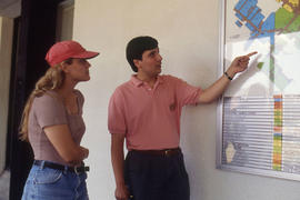 Photograph of two students looking at the campus map