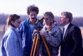 Photograph of a Civil Engineering students and their professor working with equipment