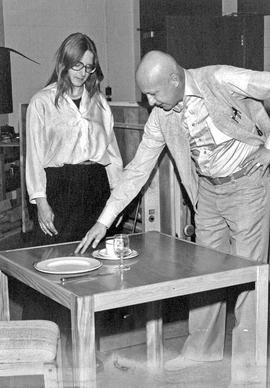 Photograph of Tim Stanley Talking to a Student