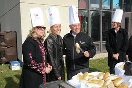 President John Davies serving hot dogs at the United Way BBQ : [photograph]