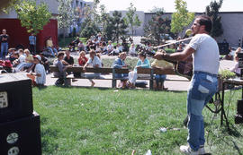 Photograph of a musician and an engaged audience