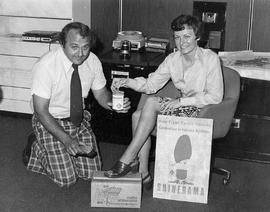 Photograph of Tom Norton Shining Gail Hitchin's Shoes at a Cystic Fibrosis Fundraiser