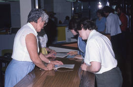 Photograph of staff testing the computer system changes