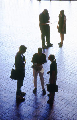 A photograph of students gathered in the concourse