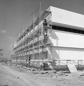 Photograph of Stucco specialists working on the North building
