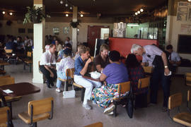 Photograph of persons gathered for a meal