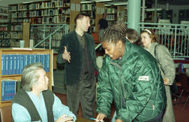 Photograph of Wayson Choy signing books