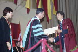 Photograph of President Robert Gordon and a graduate