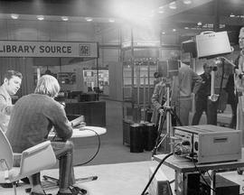 Photograph of Jerry Milan Sitting with a Technician in an Interview