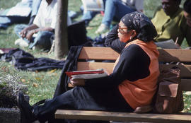 Photograph of a Student Sitting on a Bench