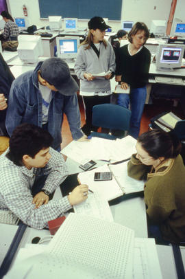 Photograph of students working together on projects in a building "J" computer lab