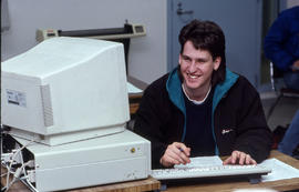 Photograph of student working in a technology computer lab