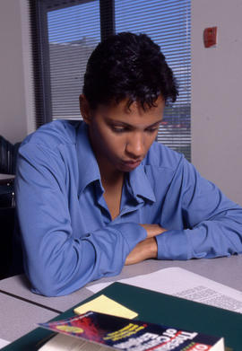 Photograph of a student working through an assignment in class