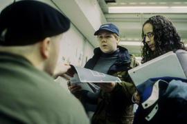 Photograph of students handing in assignments