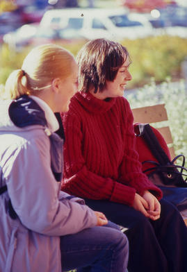 Photograph of students seated and having a conversation