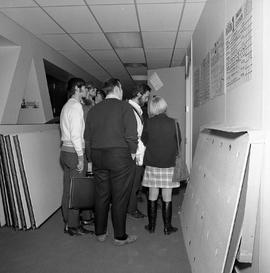 Photograph of Students in the E Building Waiting to Enter a Classroom