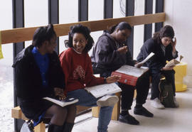 Photograph of Students Sitting on a Bench