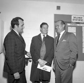 Photograph of Tom Norton and Jim Davision with a guest at the official opening of the Field House