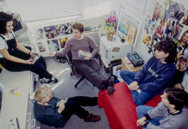 Photograph of students sitting in the residence dorm