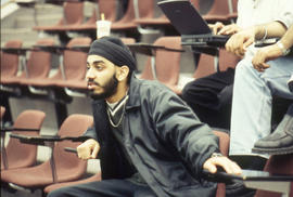 Photograph of a student participating in a discussion in the Lecture Theatre.