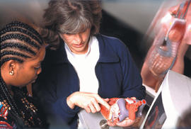 Photograph of an instructor and student engaging