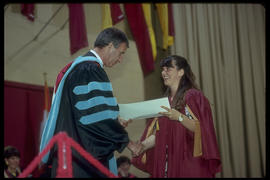 Photograph of a student receiving a Diploma from President Robert Gordon