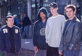 Photograph of students outdoors with cigarettes
