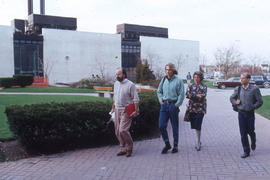 Photograph of people on the walkway to IE building