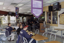 Photograph of students having lunch in the cafeteria